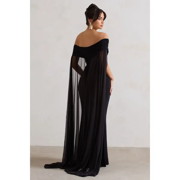 Carlotta | Robe longue noire à encolure bardot et cape en mousseline
