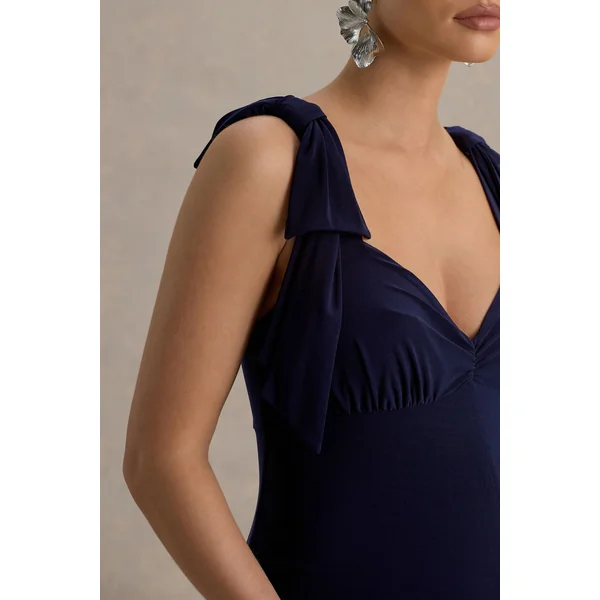 Impeccable | Combinaison de maternité bleu marine à encolure cœur et bretelles nœud