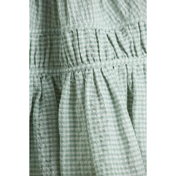 Laurelle | Mini-robe verte à décolleté ultra plongeant avec détails à volants
