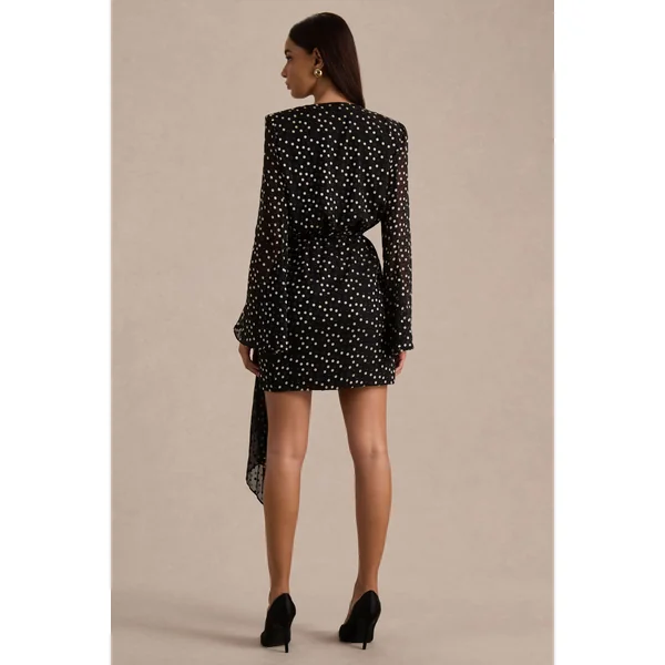 Mela | Mini-robe à pois noirs et blancs avec décolleté plongeant manches évasées et ceinture à nouer