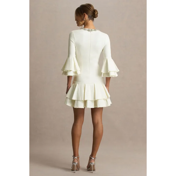 Mirna | Mini-robe crème à encolure ras-du-cou avec manches évasées et détails volantés