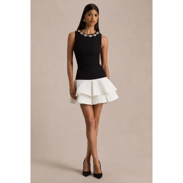 Nalani | Mini-robe noire et blanche à col rond ornée et ourlet volanté