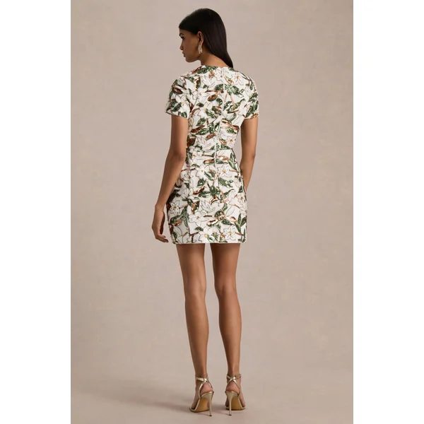 Ophelia | Mini-robe en sequins floraux blancs et verts avec empiècement en mesh et manches courtes