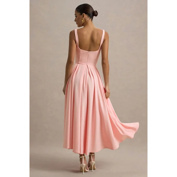 Parina | Robe mi-longue rose à bretelles et ourlet volumineux