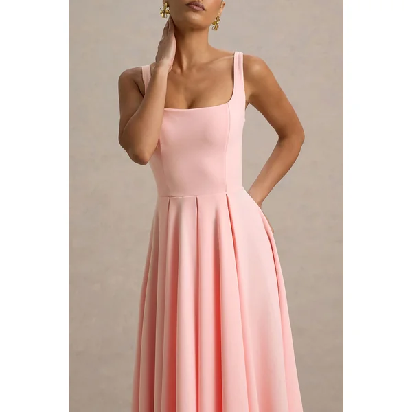 Parina | Robe mi-longue rose à bretelles et ourlet volumineux