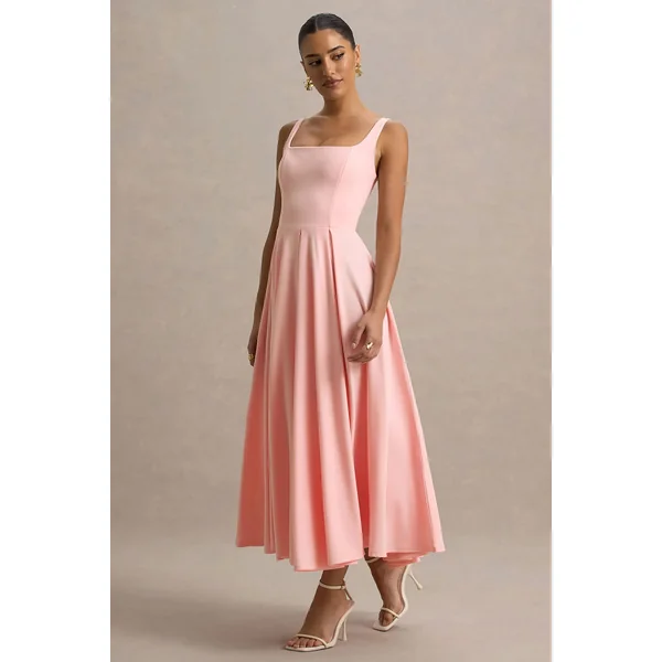 Parina | Robe mi-longue rose à bretelles et ourlet volumineux
