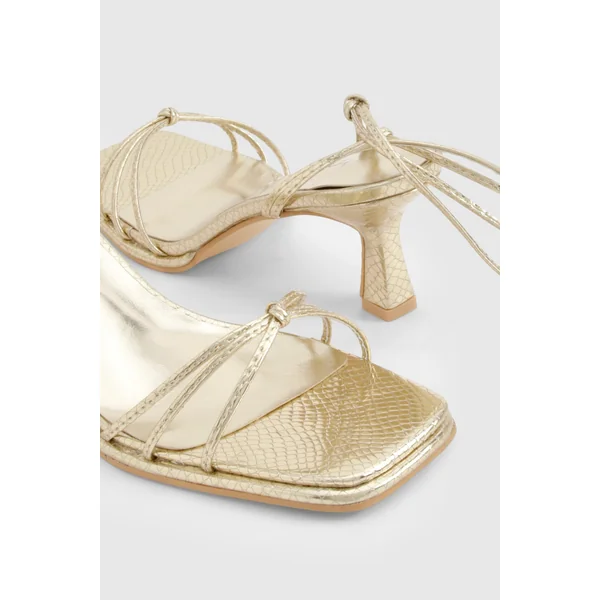 Talons métalliques à lanières effet croc et coupe large