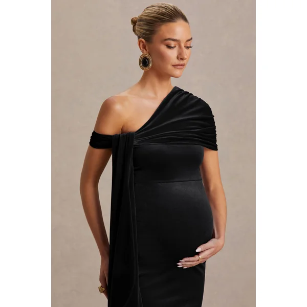 Zena | Robe mi-longue de maternité en velours noir à encolure asymétrique avec détail noué et ceinture